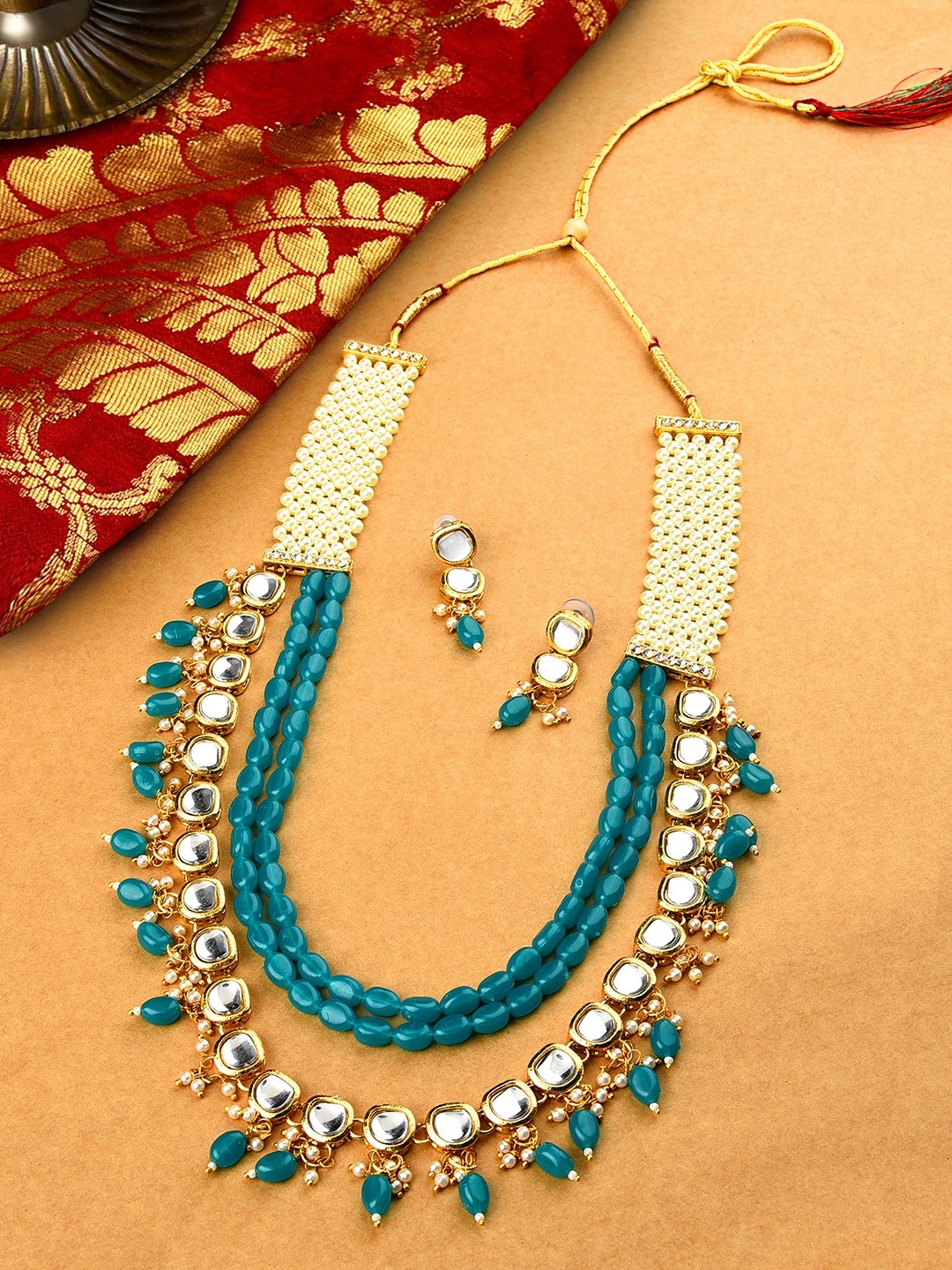 

Zaveri Pearls Green & White Gold-Plated Kundan Studded Wedding Jewellery Set