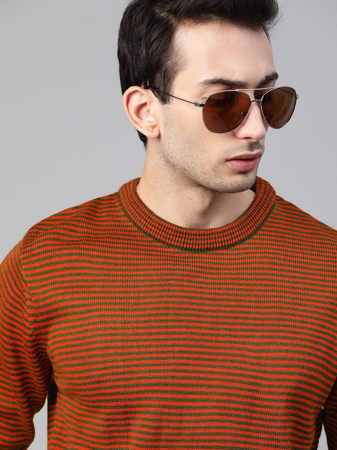 

Roadster Men Orange & Green Striped Pullover Sweater