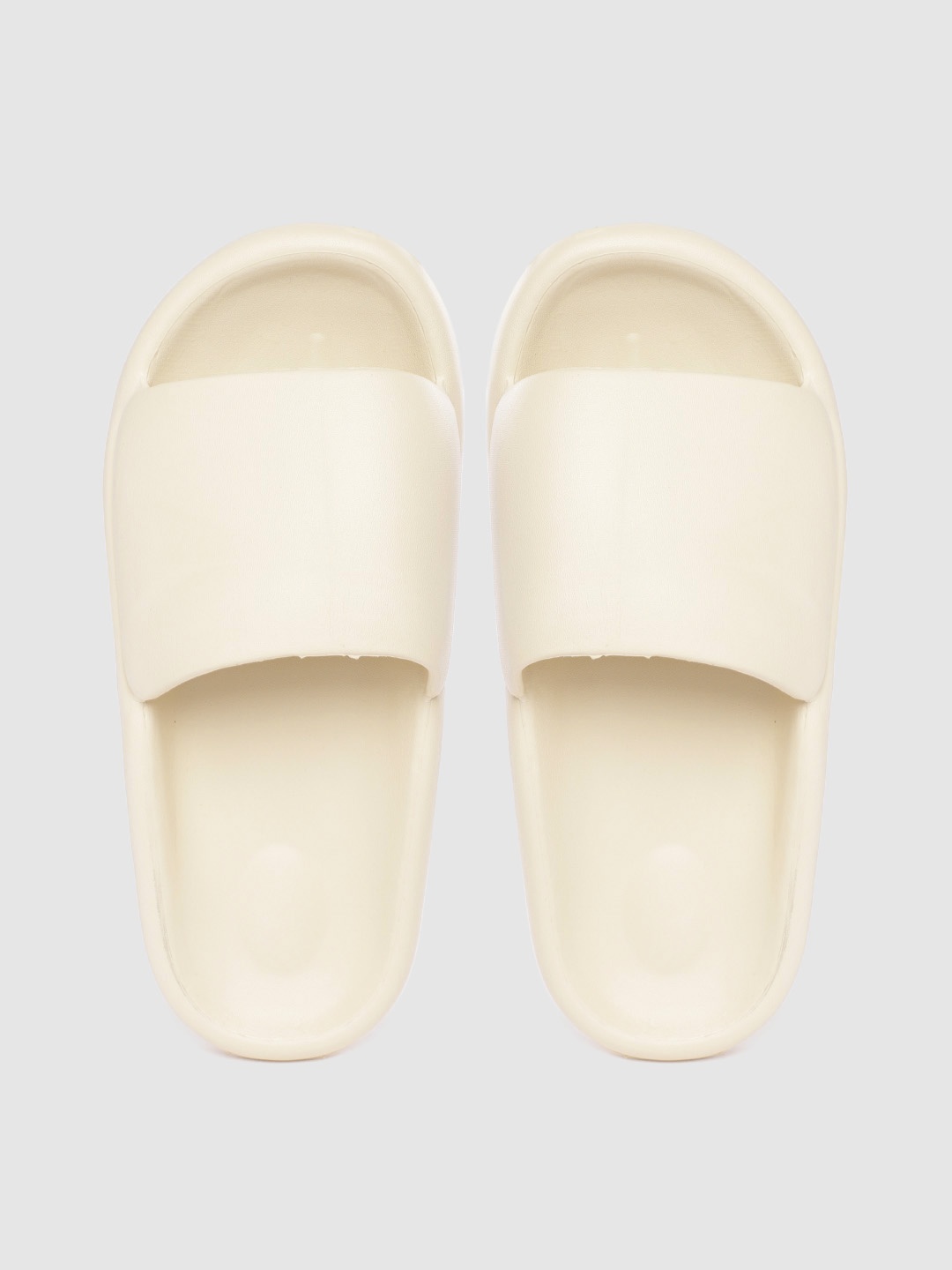 

Carlton London sports Women Light Beige Solid Sliders