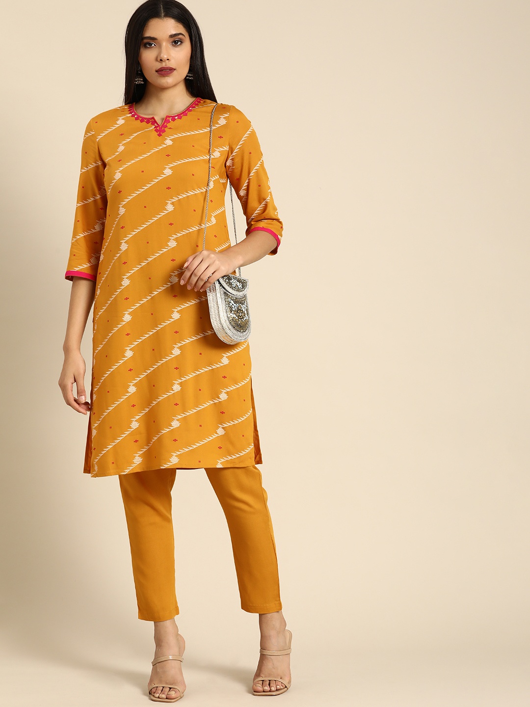 

Anouk Women Mustard Yellow Ethnic Motifs Embroidered Regular Thread Work Kurta with Trousers