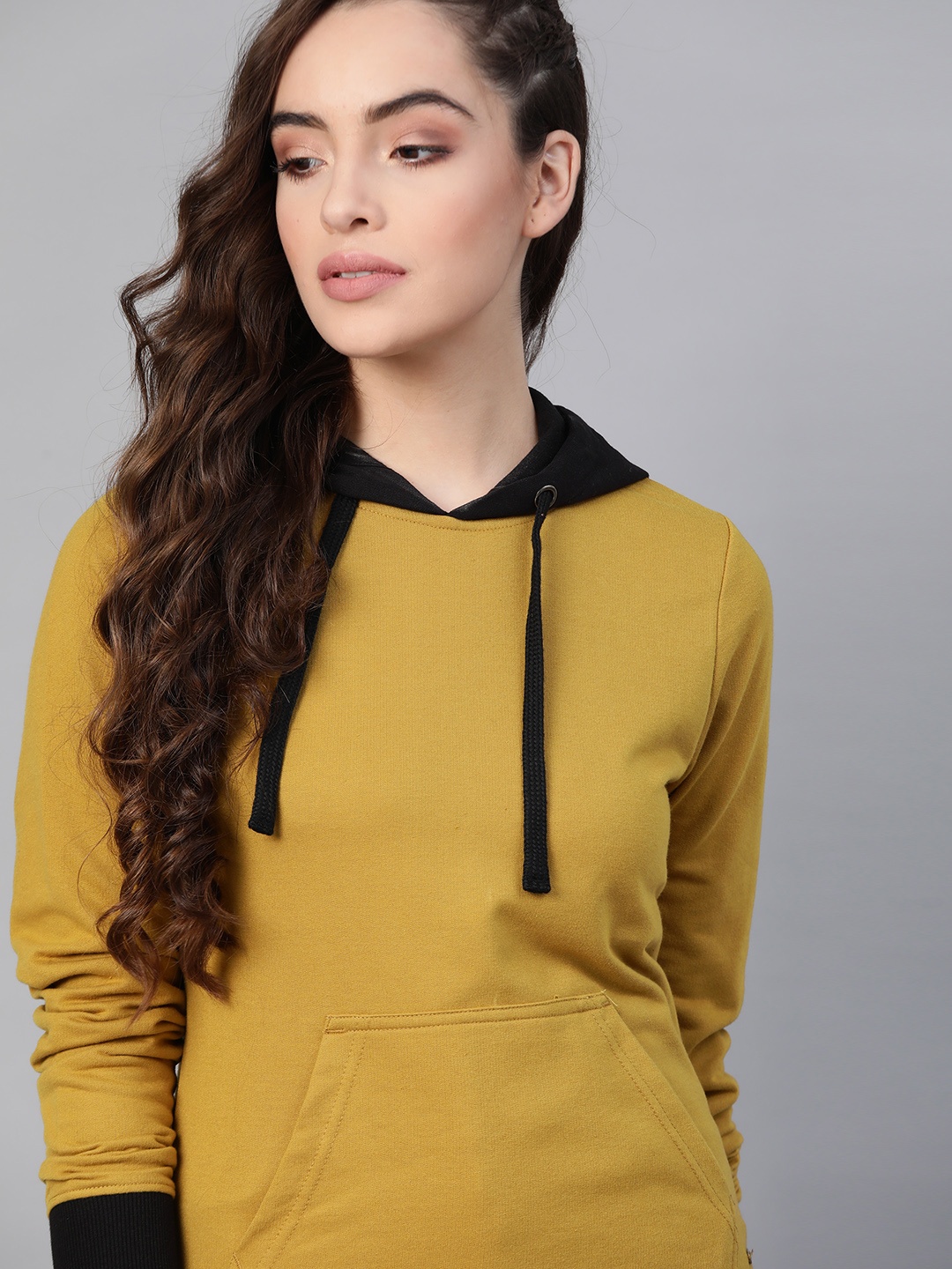 

Roadster Women Mustard Yellow Solid Hooded Sweatshirt