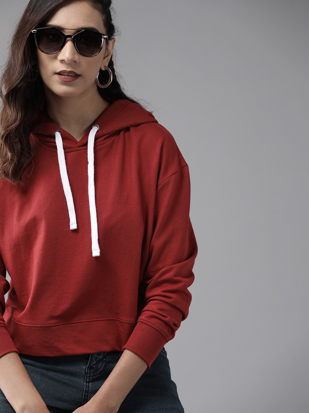 

Roadster Women Maroon Solid Hooded Sweatshirt