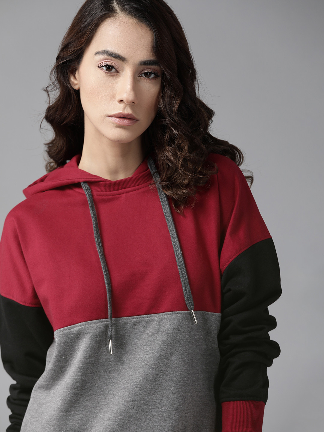 

Roadster Women Maroon & Grey Melange Colourblocked Hooded Sweatshirt