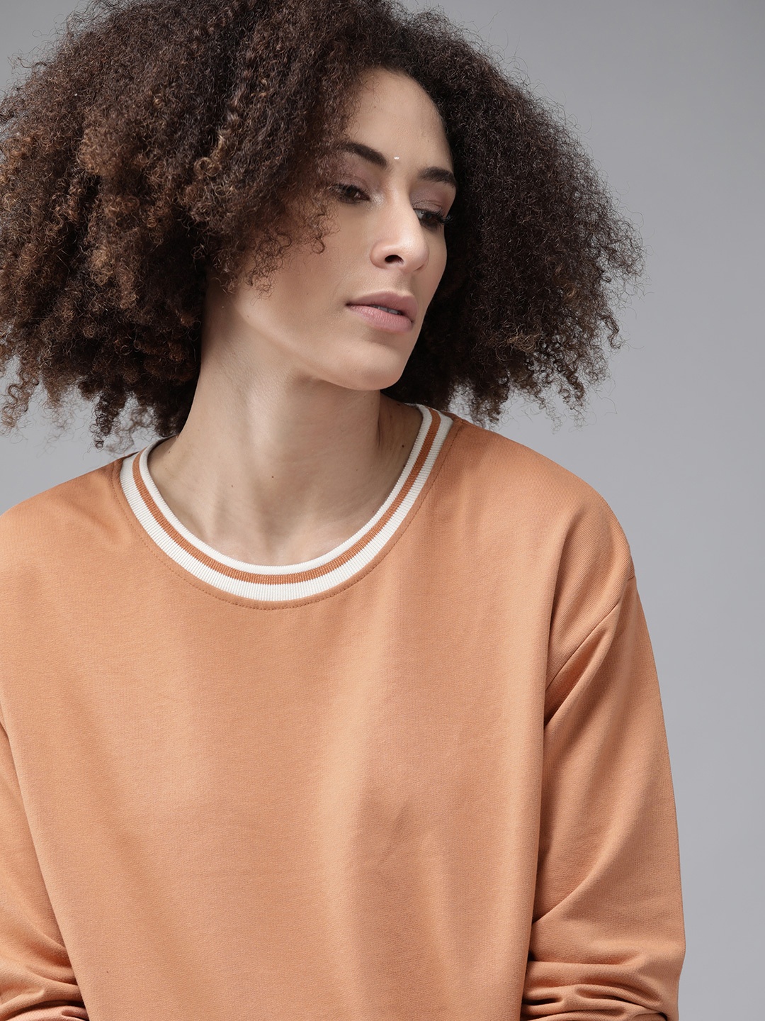 

Roadster Women Peach-Coloured Solid Drop-Shoulder Sweatshirt