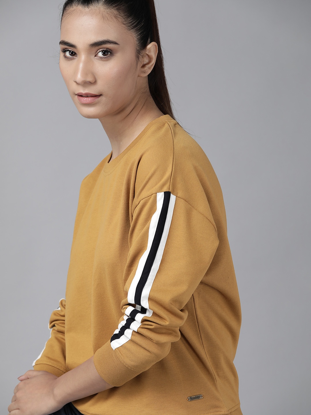 

Roadster Women Mustard Yellow Solid Sweatshirt