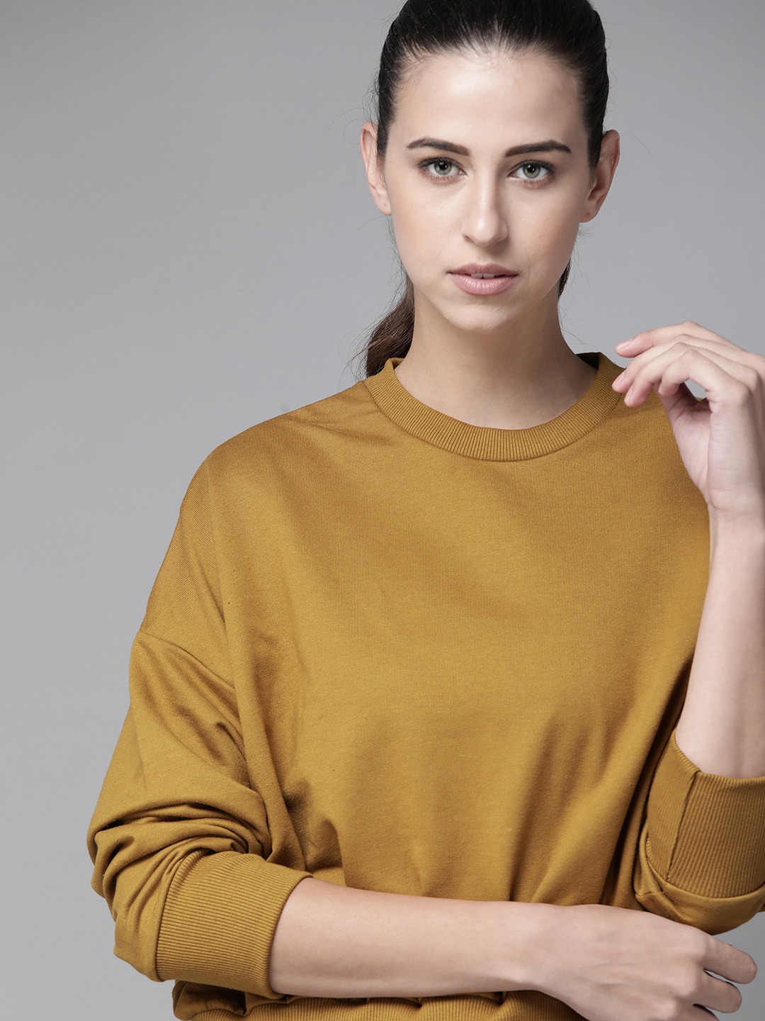 

Roadster Women Khaki Solid Drop-Shoulder Sleeves Sweatshirt