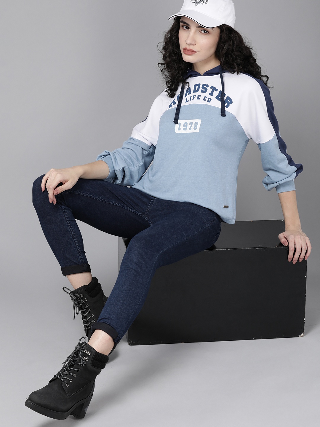 

Roadster Women Blue & White Colourblocked Hooded Sweatshirt