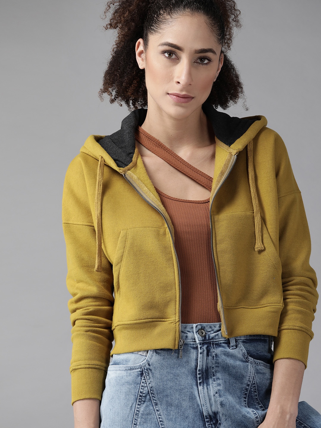 

Roadster Women Mustard Yellow Solid Hooded Sweatshirt