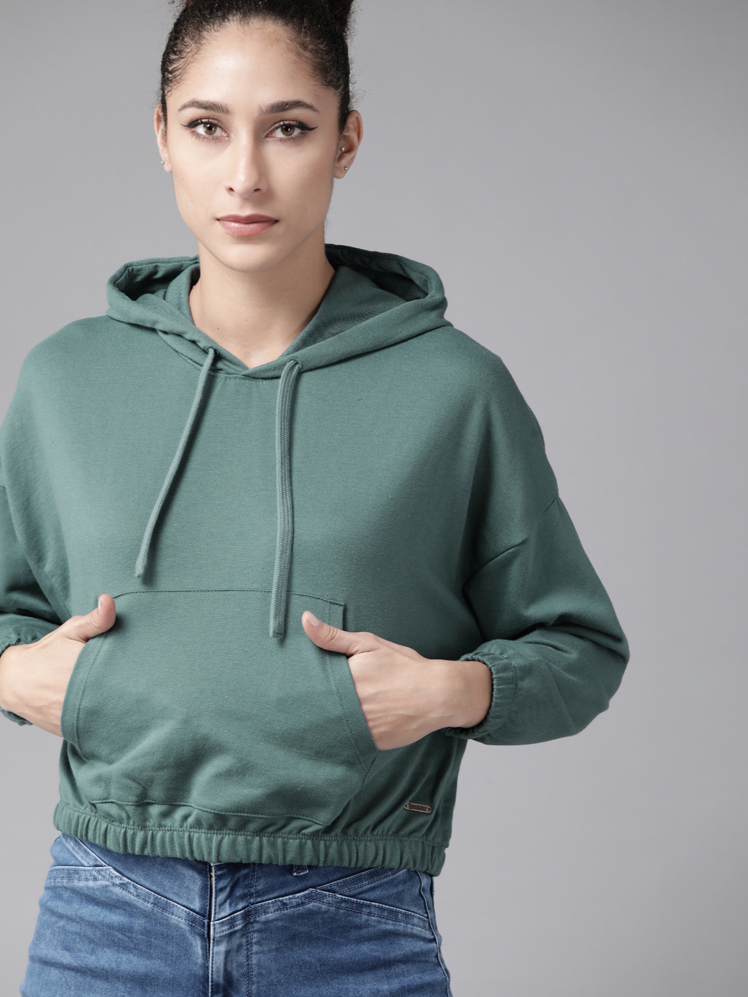 

Roadster Women Green Solid Hooded Sweatshirt