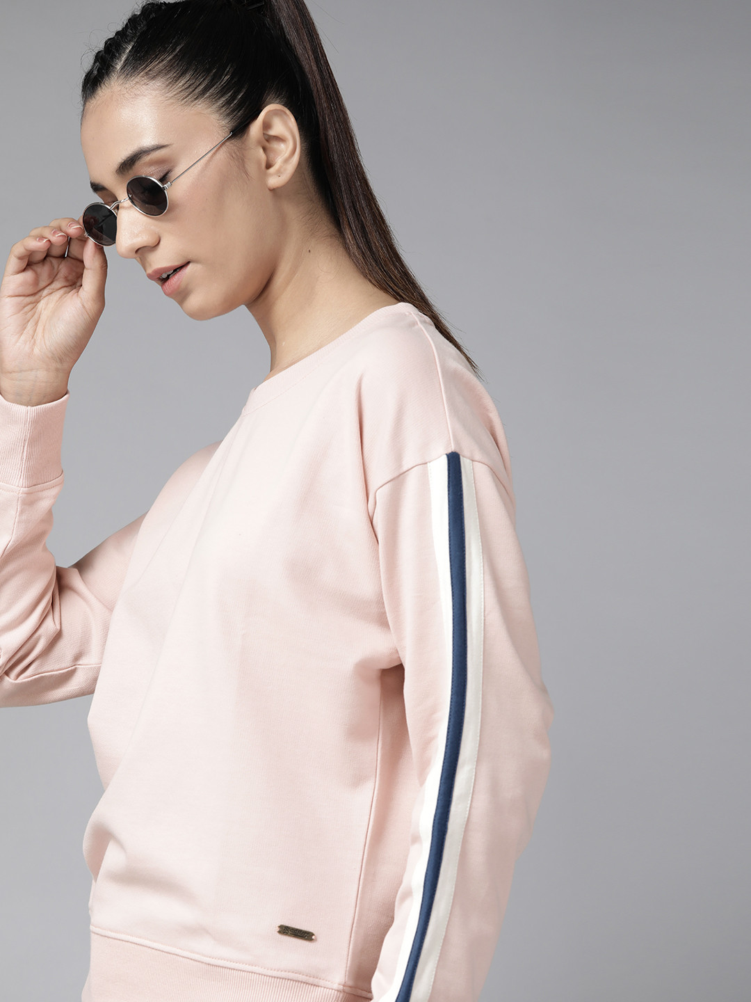 

Roadster Women Peach-Coloured Solid Sweatshirt