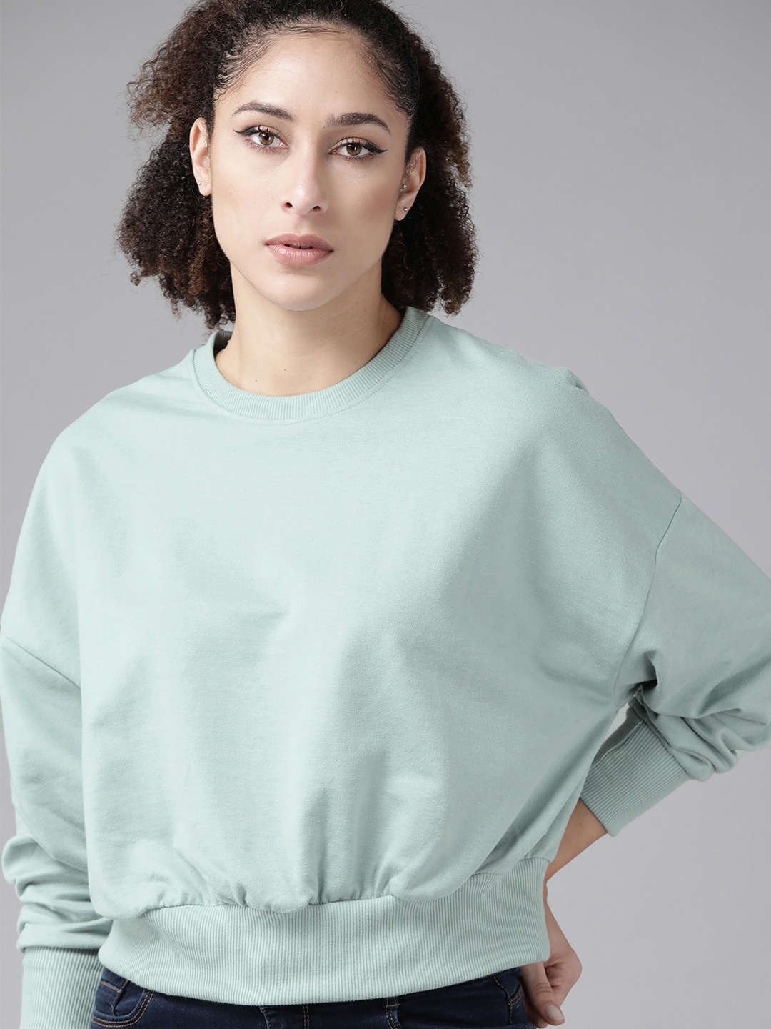 

Roadster Women Sea Green Solid Sweatshirt