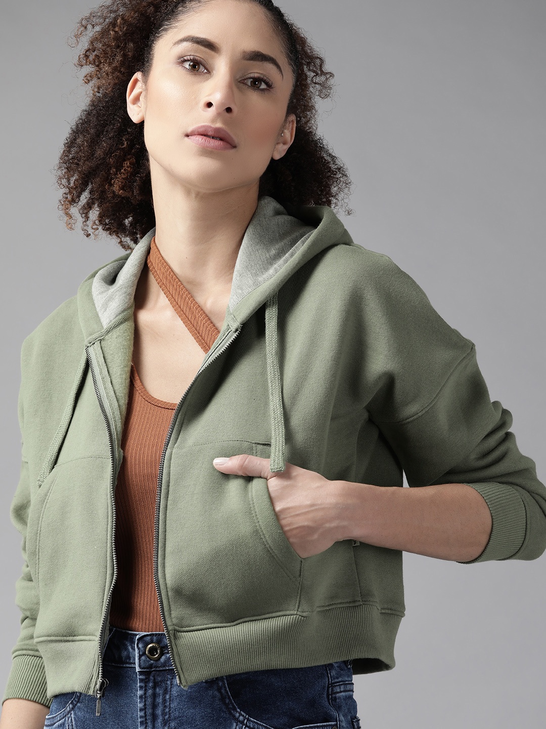 

Roadster Women Olive Green Solid Hooded Sweatshirt