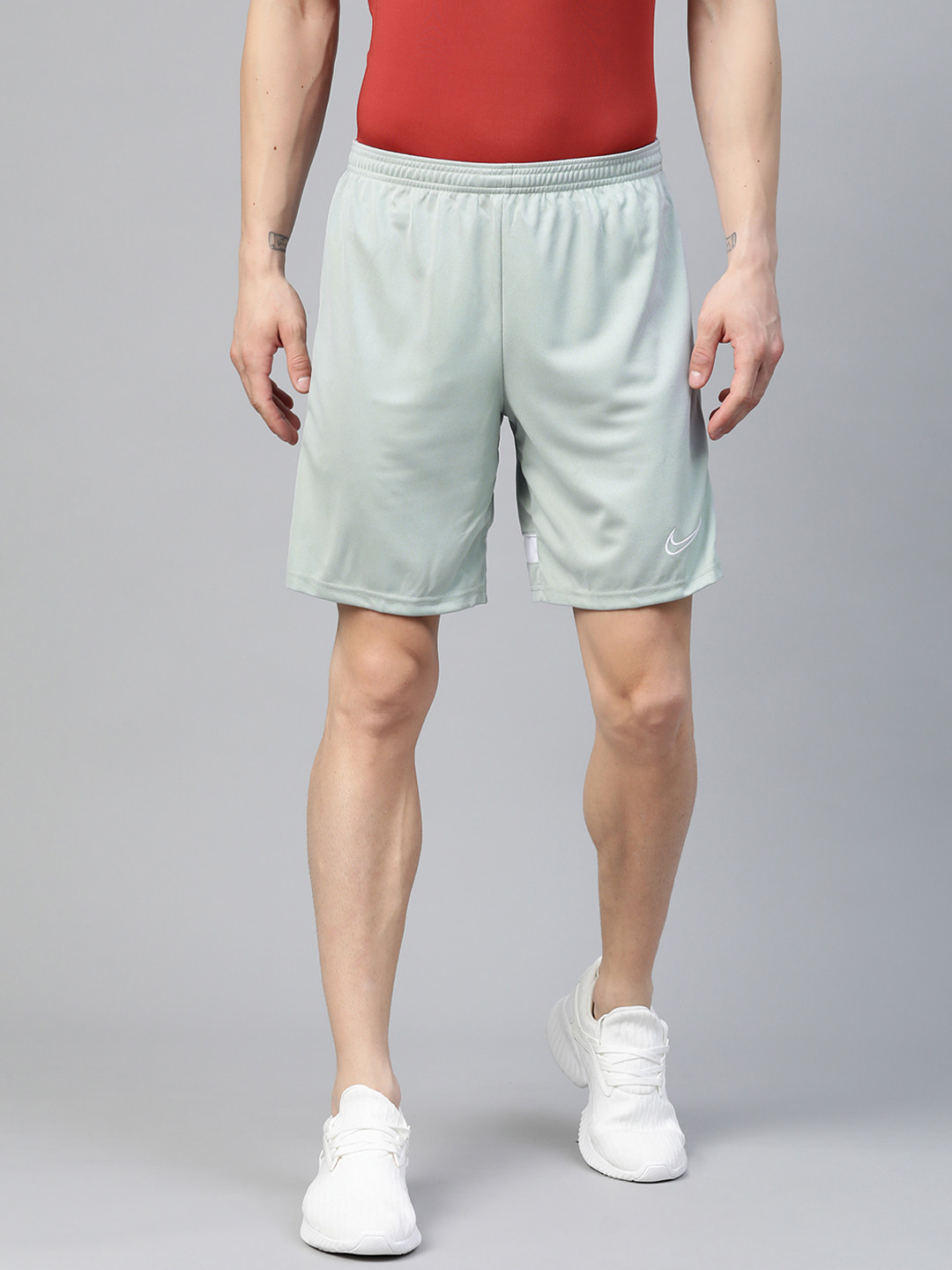 

Nike Men Blue Solid Mid-Rise Sports Shorts