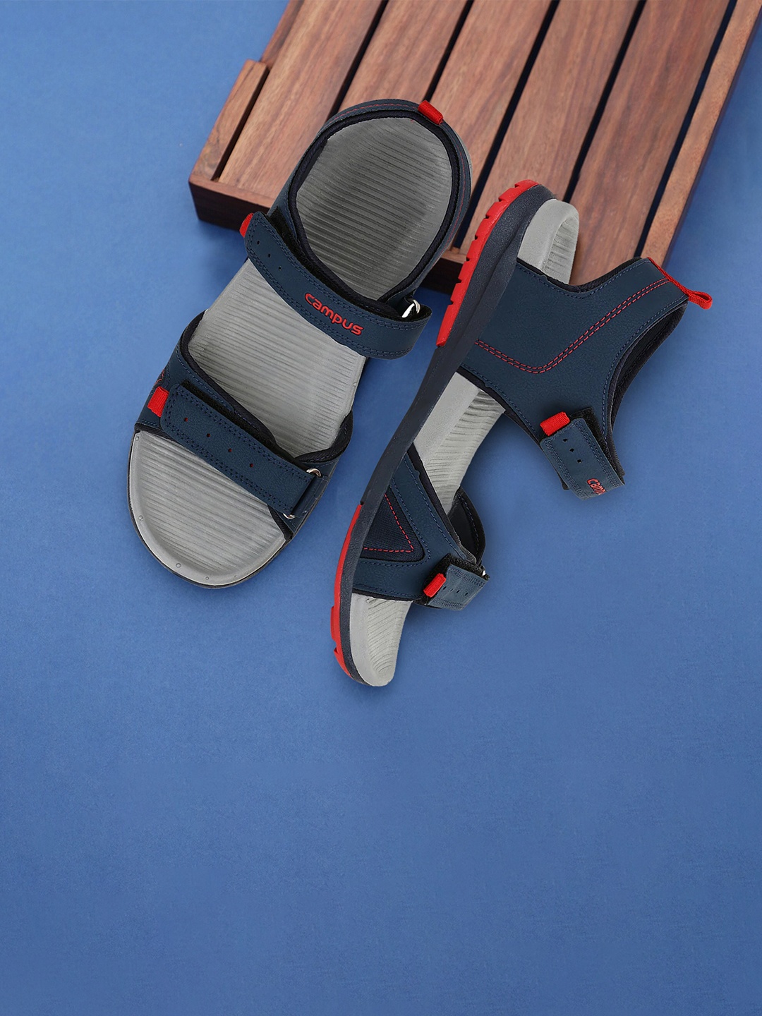 

Campus Men Navy Blue & Grey Solid Sports Sandals