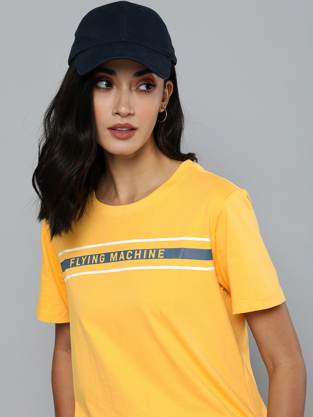 

Flying Machine Women Yellow & White Typography Printed Pure Cotton T-shirt