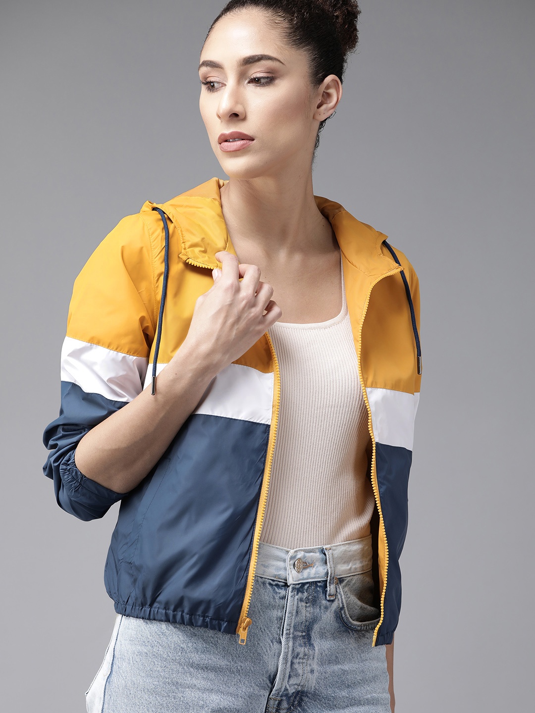 

Roadster Women Mustard Yellow & Blue Colourblocked Windcheater Hooded Jacket