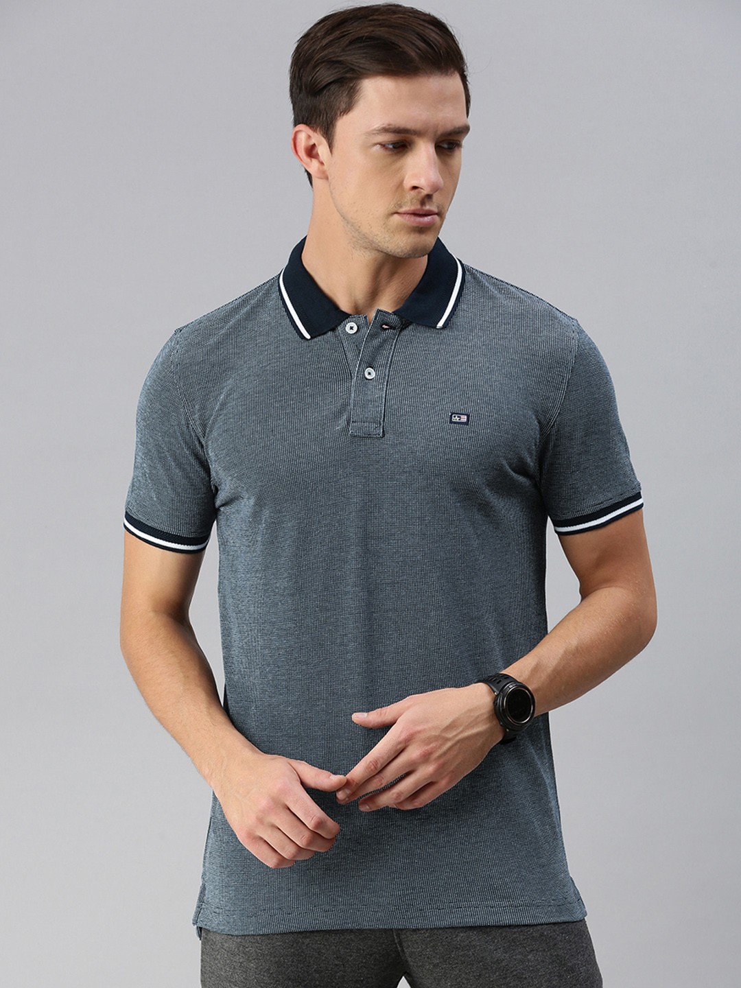 

Arrow Sport Men Navy Blue White Self Design Polo Collar Pure Cotton T-shirt