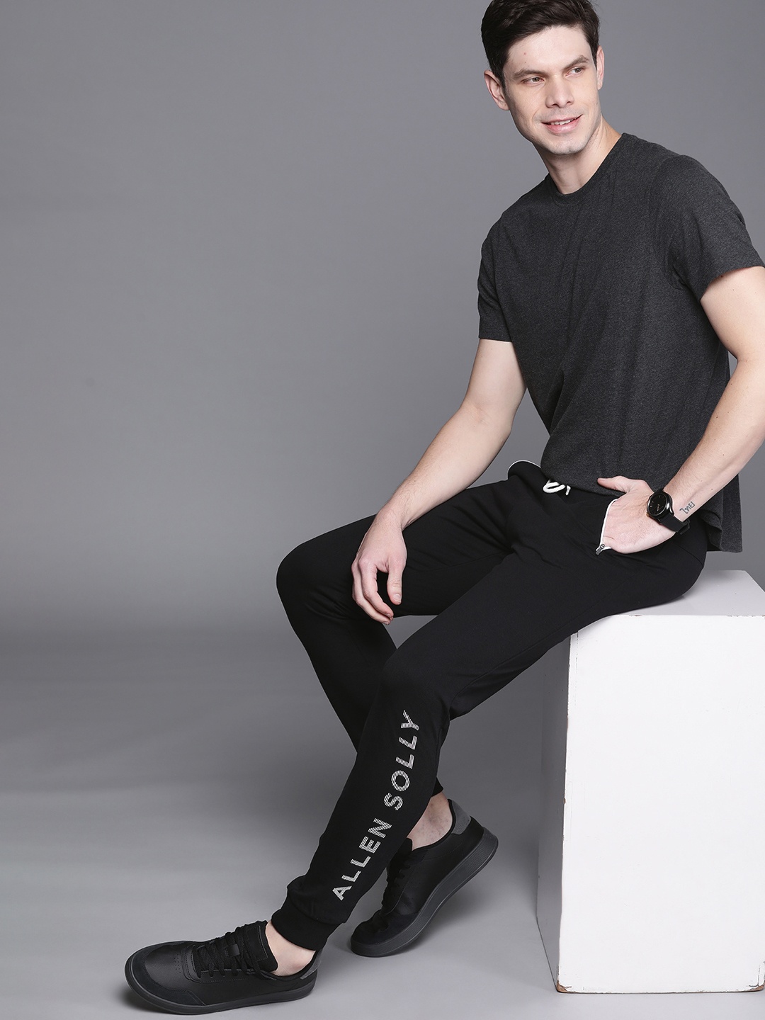 

Allen Solly Sport Men Black Pure Cotton Solid Joggers With Printed Details