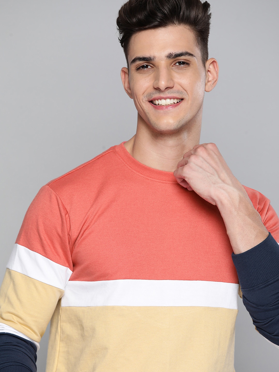 

Mast & Harbour Men Beige & Coral Pink Colourblocked Sweatshirt