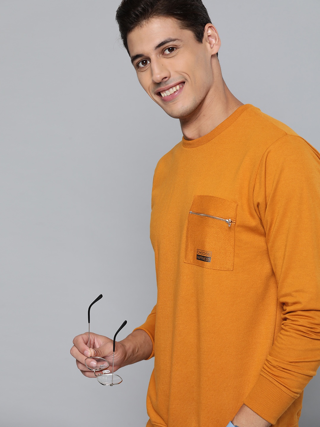 

Mast & Harbour Men Mustard Yellow Solid Sweatshirt