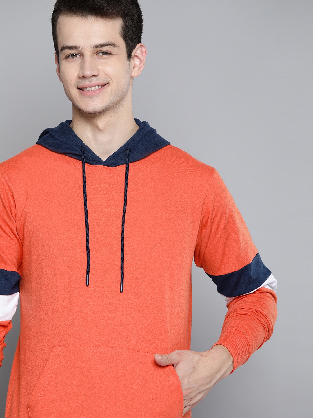 

Mast & Harbour Men Coral Orange Solid Hooded Sweatshirt