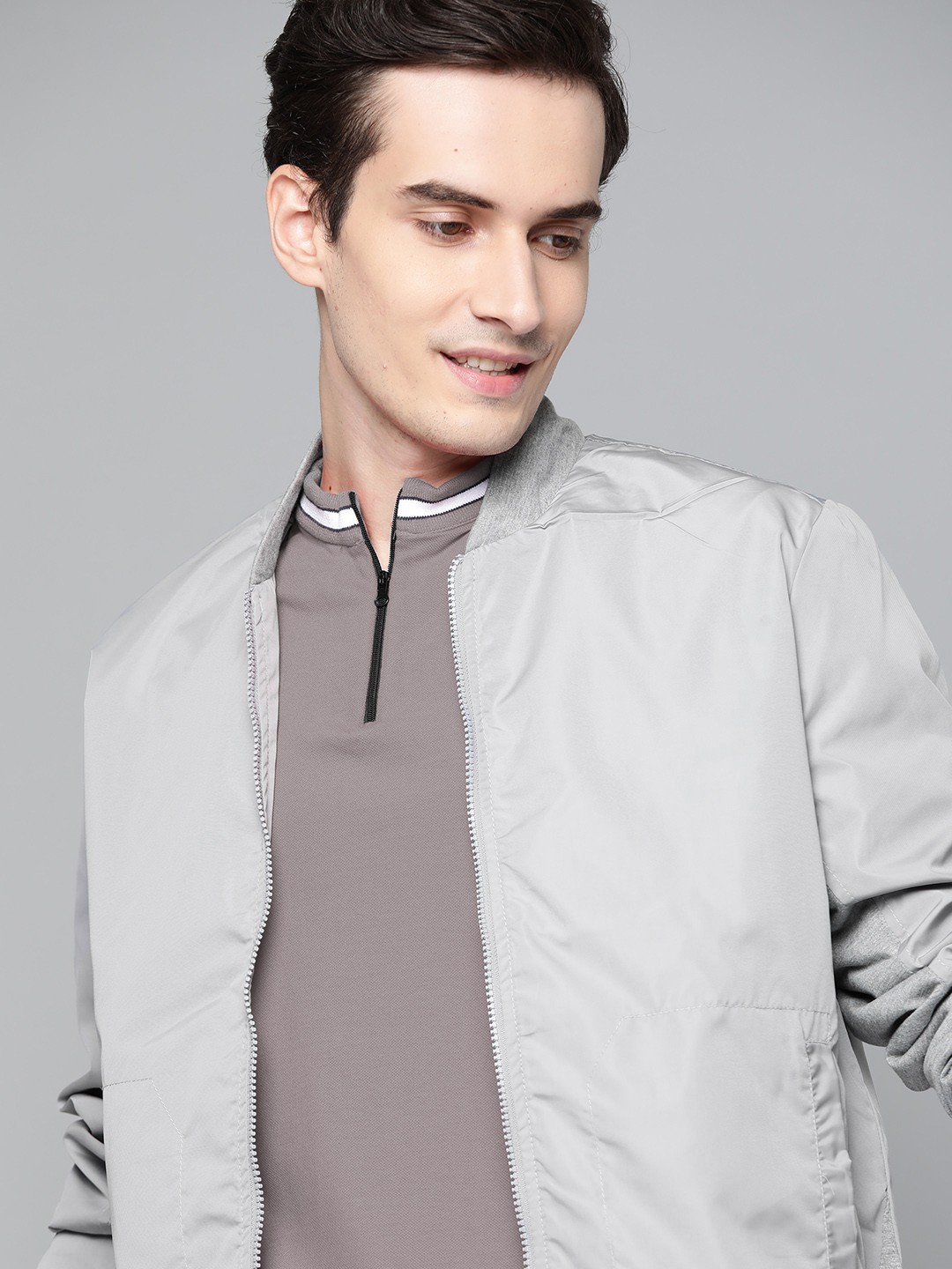 

Mast & Harbour Men Grey Solid Hooded Bomber Jacket