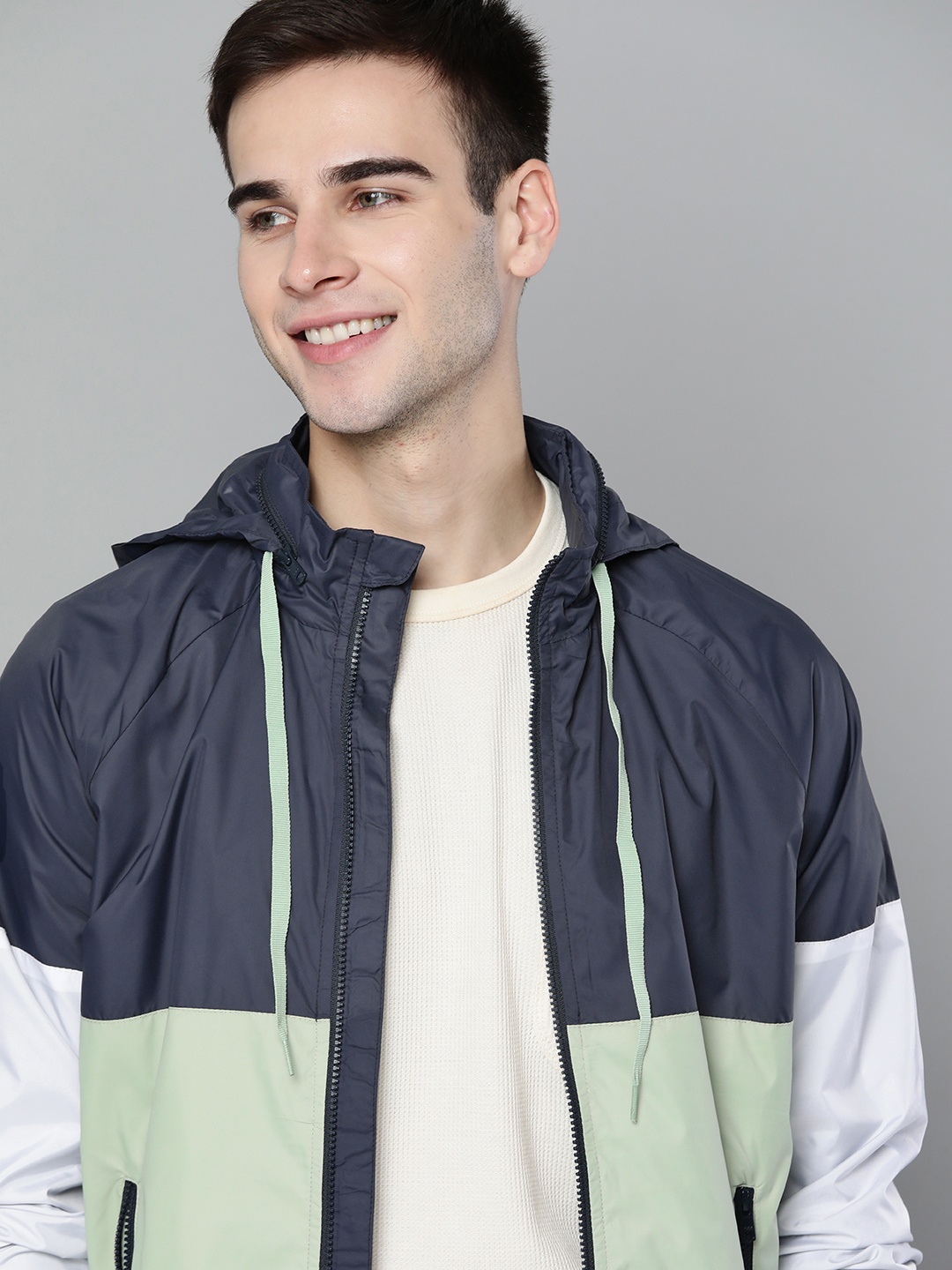 

Mast & Harbour Men Navy Blue & Green Colourblocked Lightweight Bomber Jacket