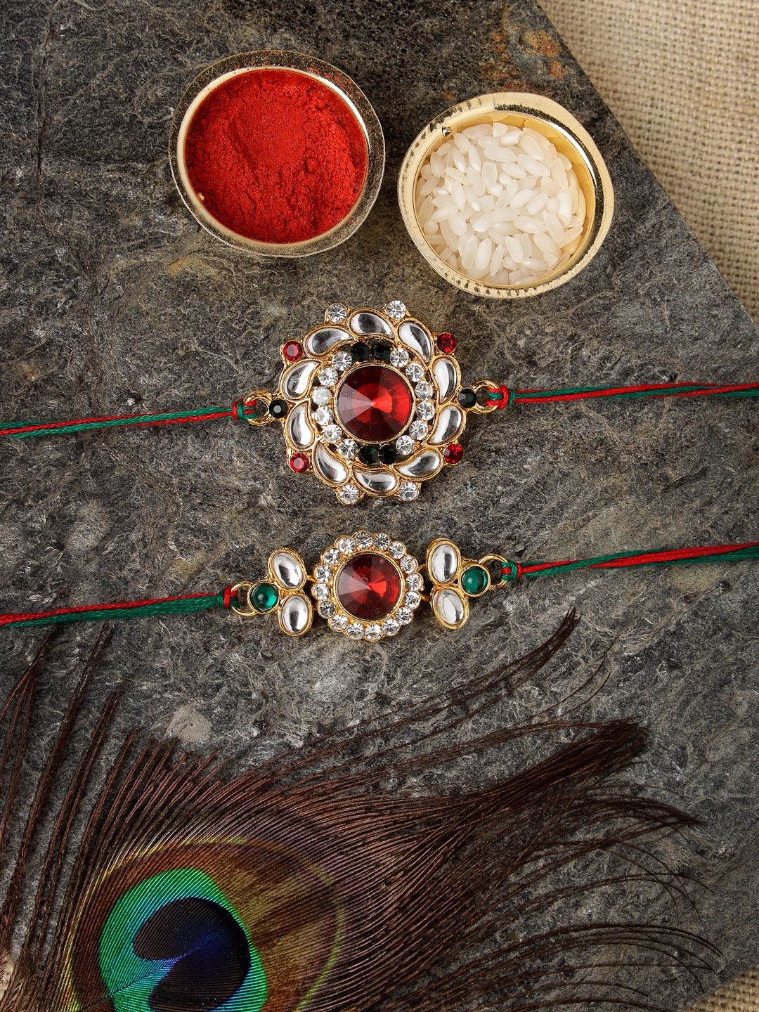 

Sukkhi Rakhi Men Set Of 2 Gold-Plated Red & White Stone-Studded Rakhis With Roli Chawal & Raksha Bandhan Greeting Card