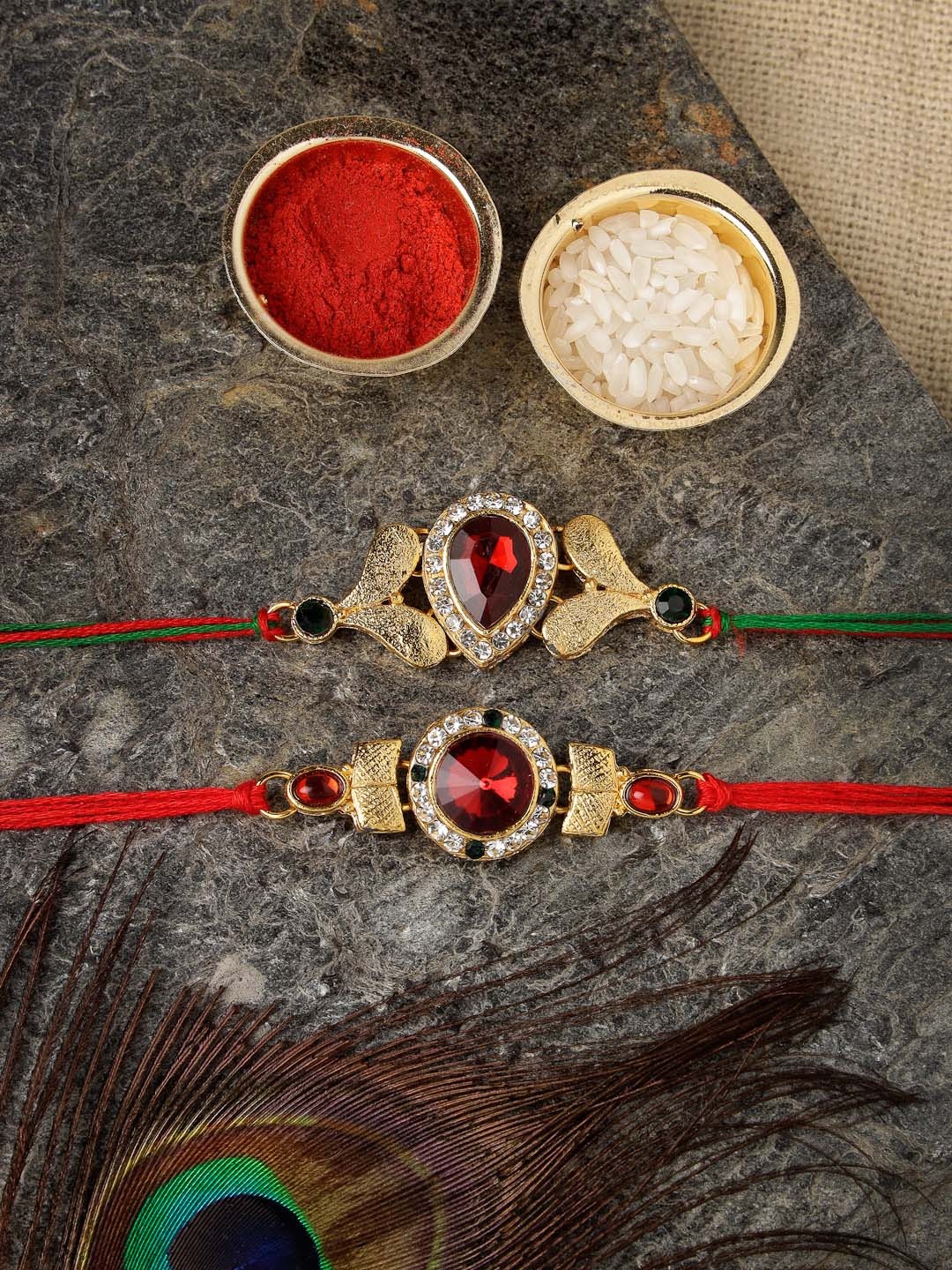 

Sukkhi Rakhi Men Set Of 2 Gold Plated & Red Rakhi With Roli Chawal And Raksha Bandhan Greeting Card