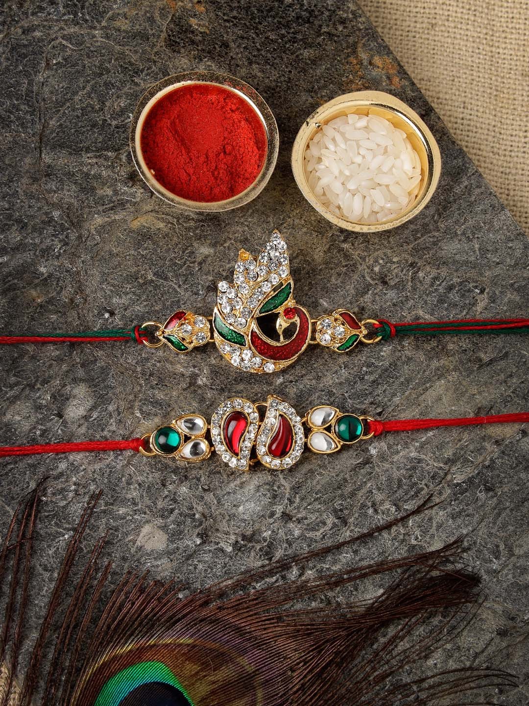 

Sukkhi Rakhi Men Set Of 2 Gold-Plated Red & White Stone-Studded Rakhi With Roli Chawal & Raksha Bandhan Greeting Card