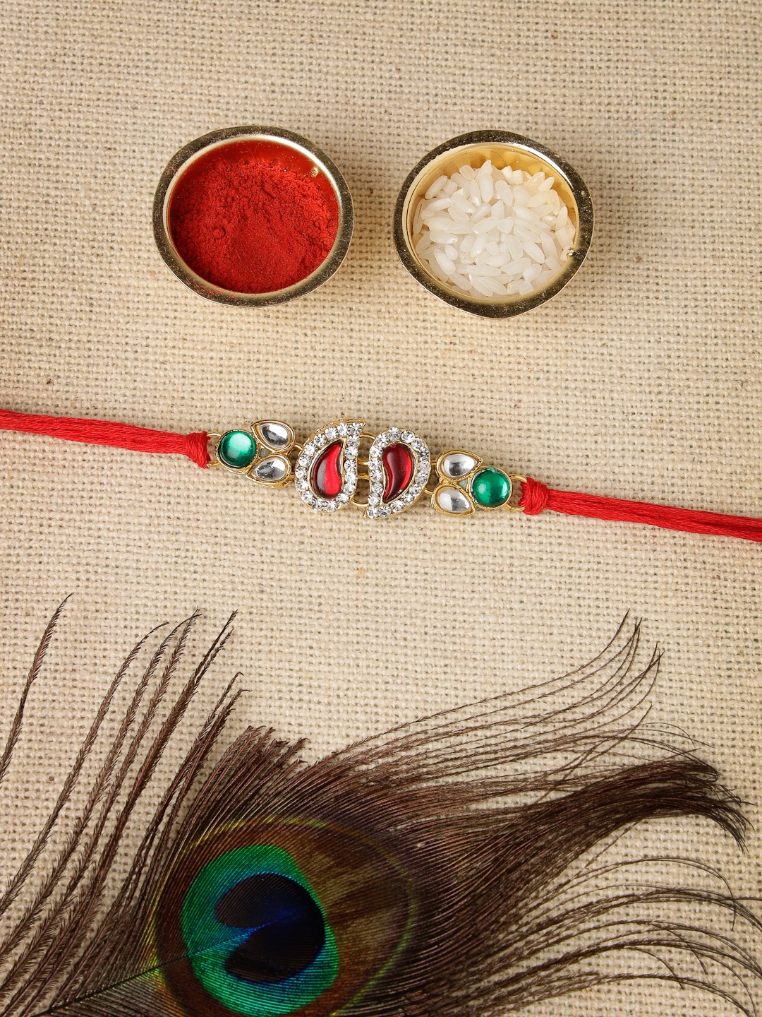 

Sukkhi Rakhi Men Gold-Plated Red & White Stone-Studded Rakhi With Roli Chawal & Greeting Card