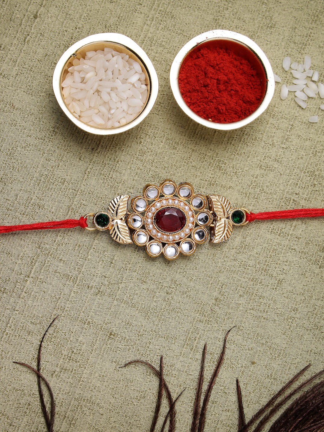 

Sukkhi Rakhi Men Red Gold-Plated Stone-Studded Rakhi With Roli Chawal & Greeting Card