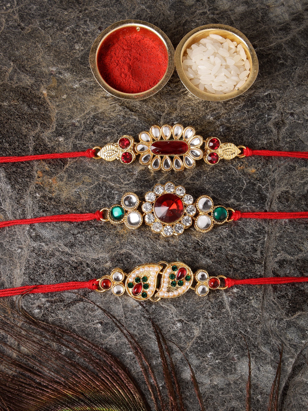 

Sukkhi Rakhi Men Set Of 3 Red Gold-Plated Stone-Studded Rakhi With Roli Chawal & Greeting Card
