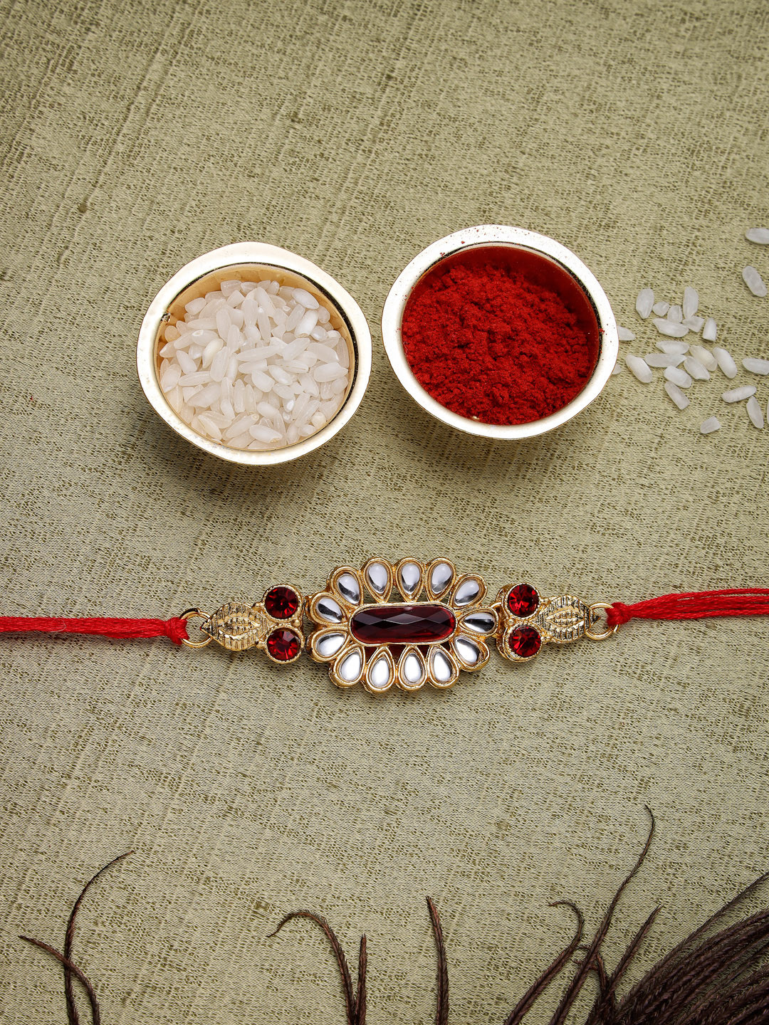 

Sukkhi Rakhi Men Red Gold-Plated Stone-Studded Rakhi With Roli Chawal & Greeting Card