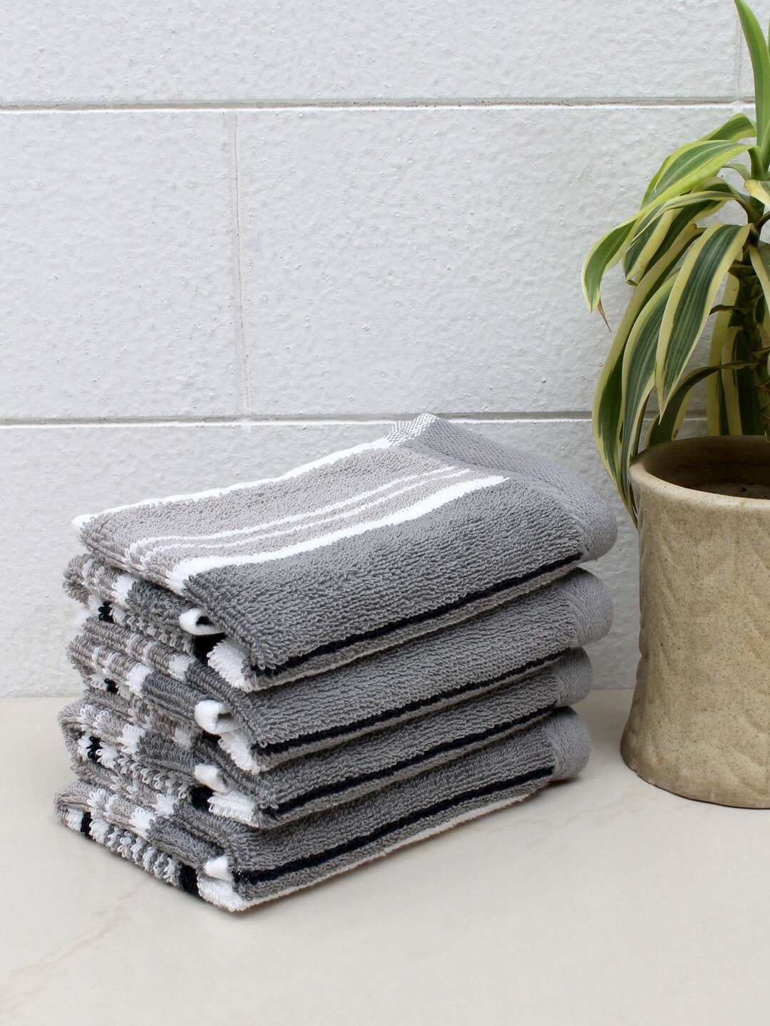 

AVI Living Pack Of 4 Grey & White Striped 600 GSM Cotton Face Towels