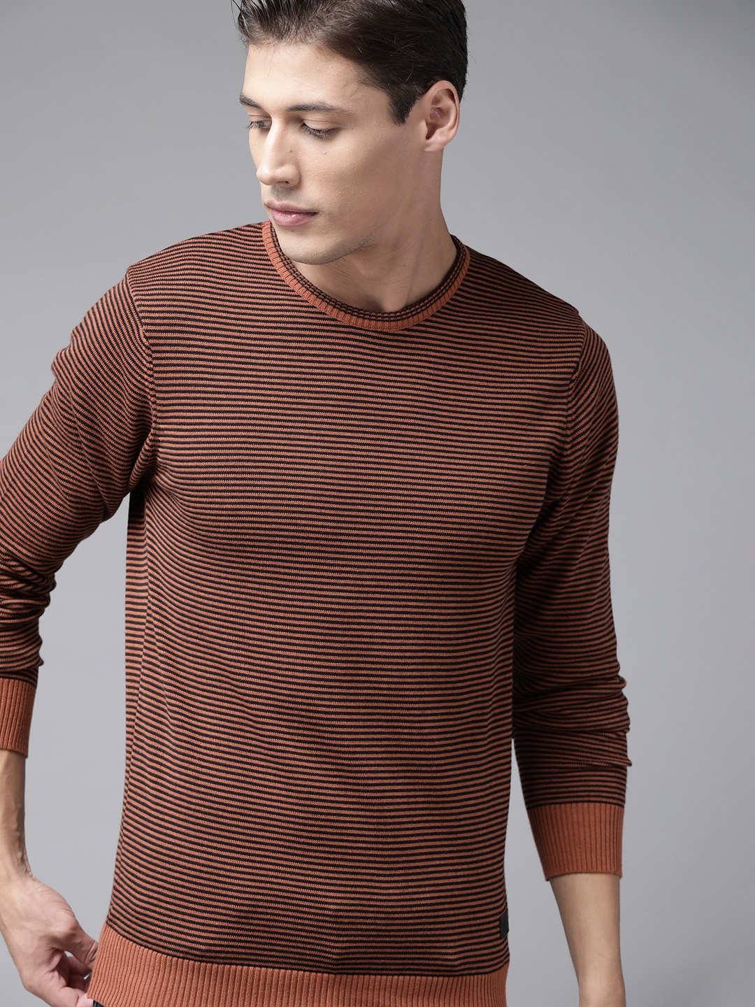 

Roadster Men Black & Rust Orange Striped Pullover Sweater
