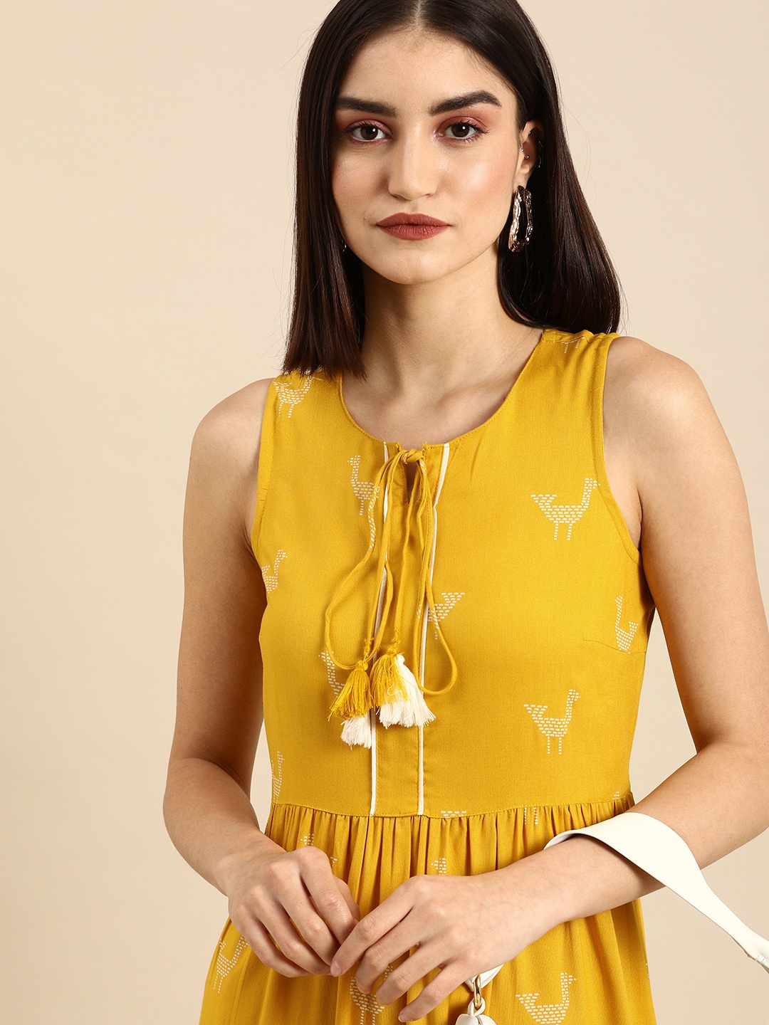 

all about you Women Mustard Yellow Printed Tie-Up Neck Fit And Flare Sleeveless Midi Dress