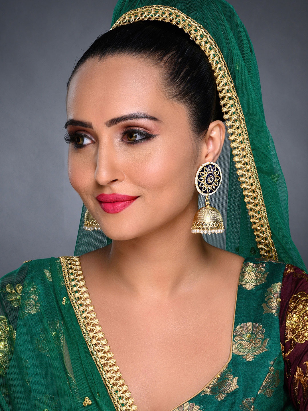 

Sukkhi Blue Gold-Plated Kundan Studded Dome Shaped Jhumkas