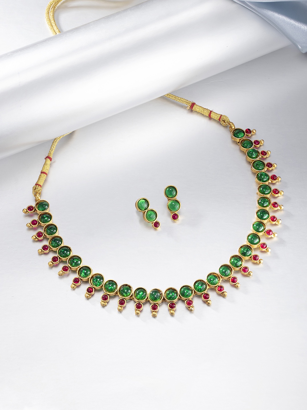

Peora Green & Red Gold-Plated Studded Jadau Jewellery Set