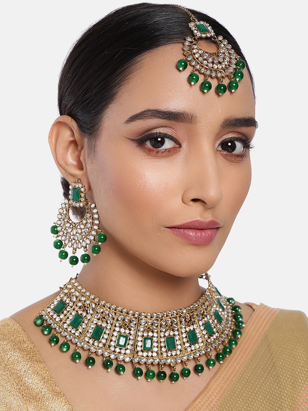 

Peora Gold Plated & Green Handcrafted Kundan & Pearl Studded Jewellery Set