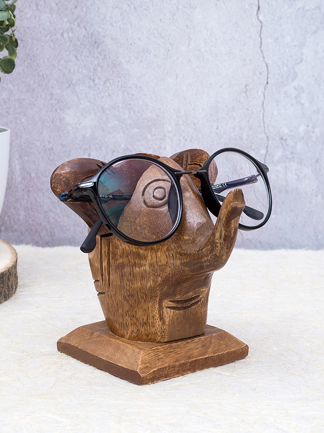 

Golden Peacock Brown Handcrafted Baby Elephant Shaped Eye Glass Spectacle Holder Showpiece