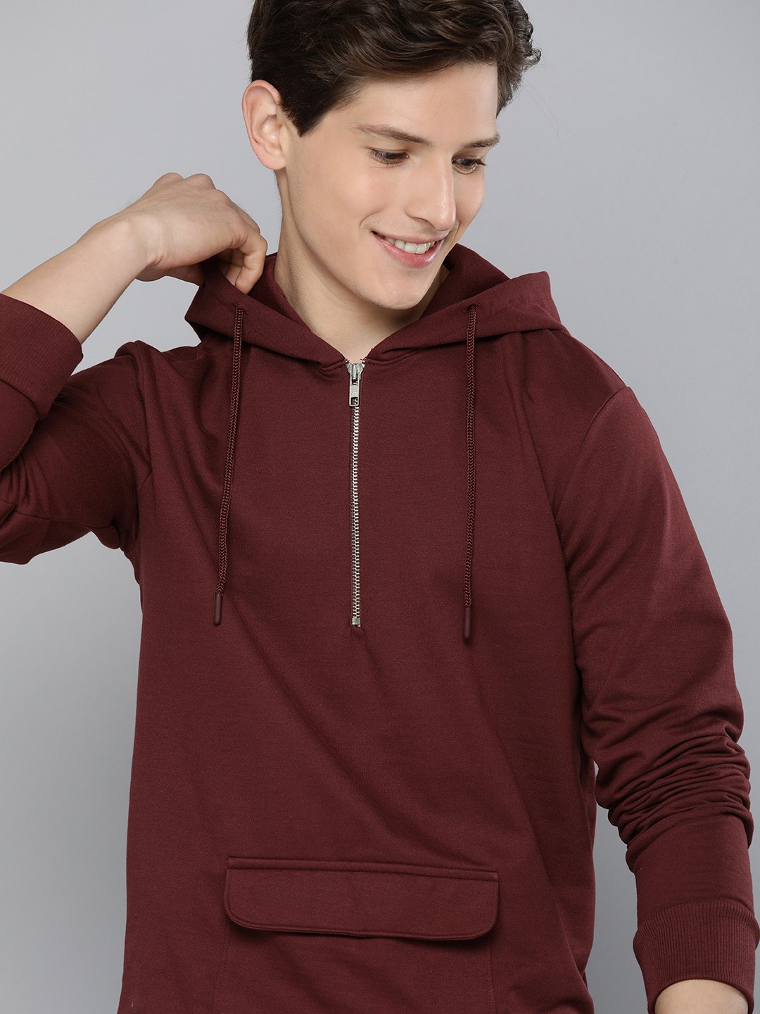 

Mast & Harbour Men Maroon Solid Hooded Sweatshirt