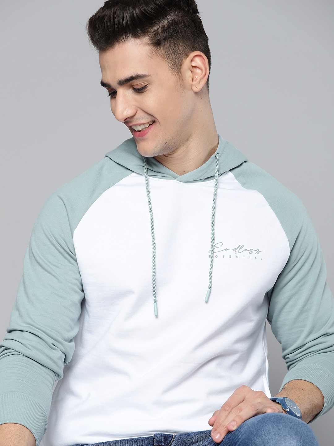 

Mast & Harbour Men White & Turquoise Blue Solid Hooded Sweatshirt