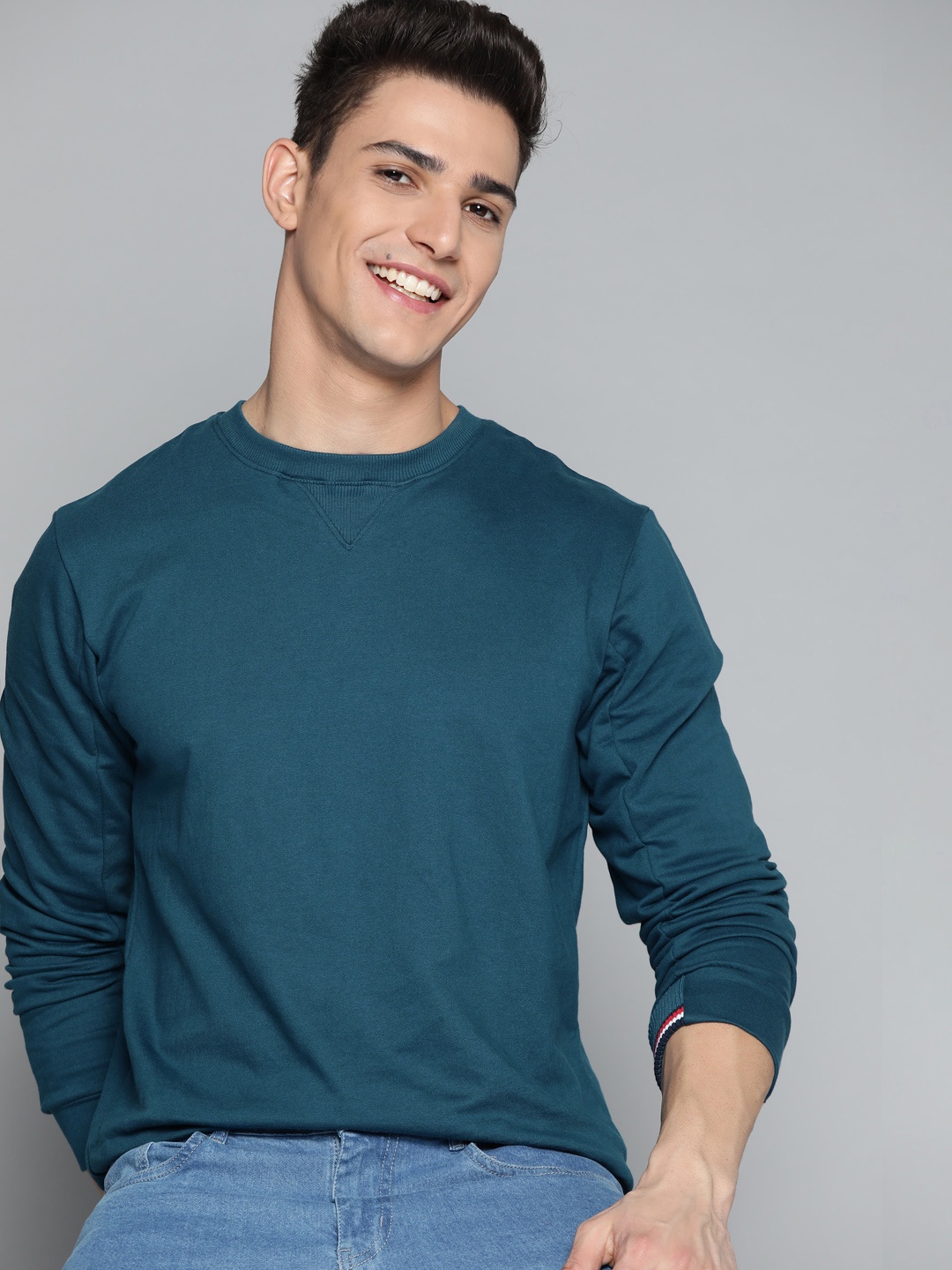 

Mast & Harbour Men Teal Solid Sweatshirt