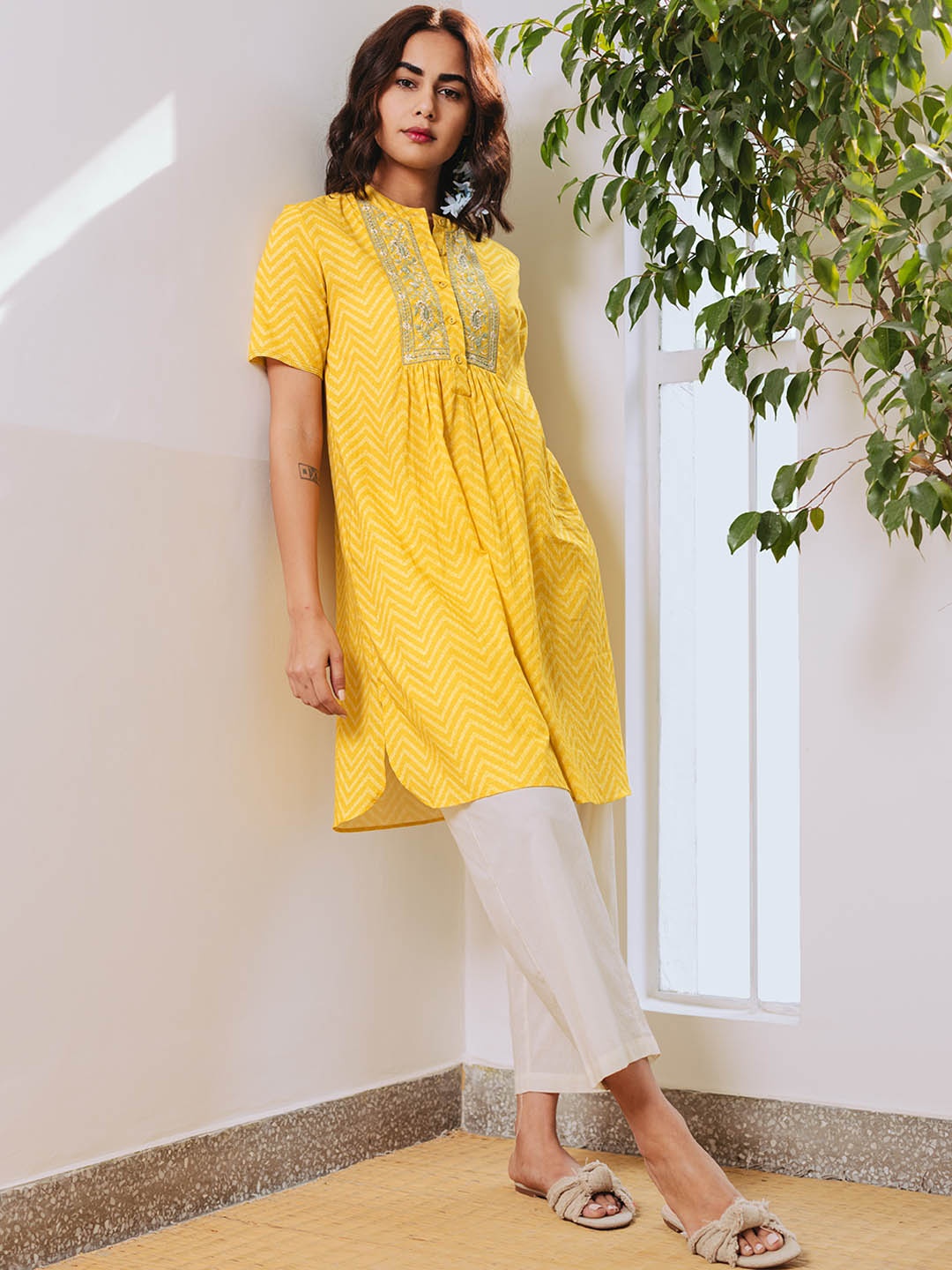 

aarke Ritu Kumar Women Yellow Printed Thread Work Kurta with Trousers