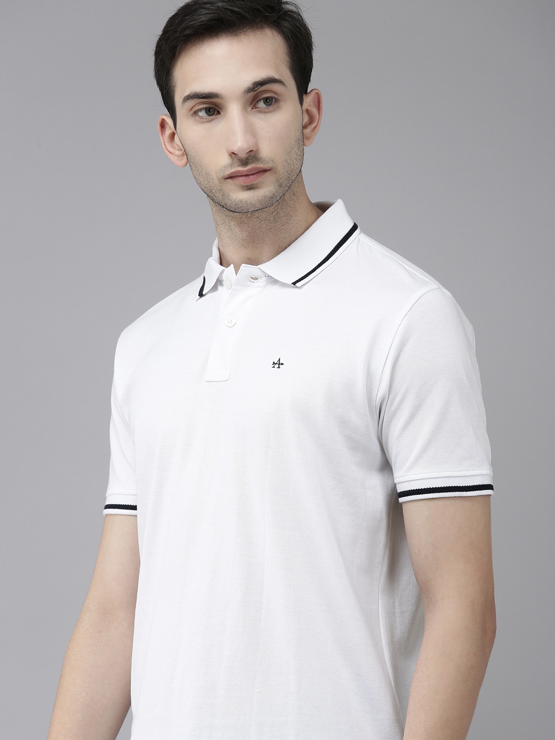 

Arrow Sport Men White Solid Pure Cotton Polo Collar T-shirt