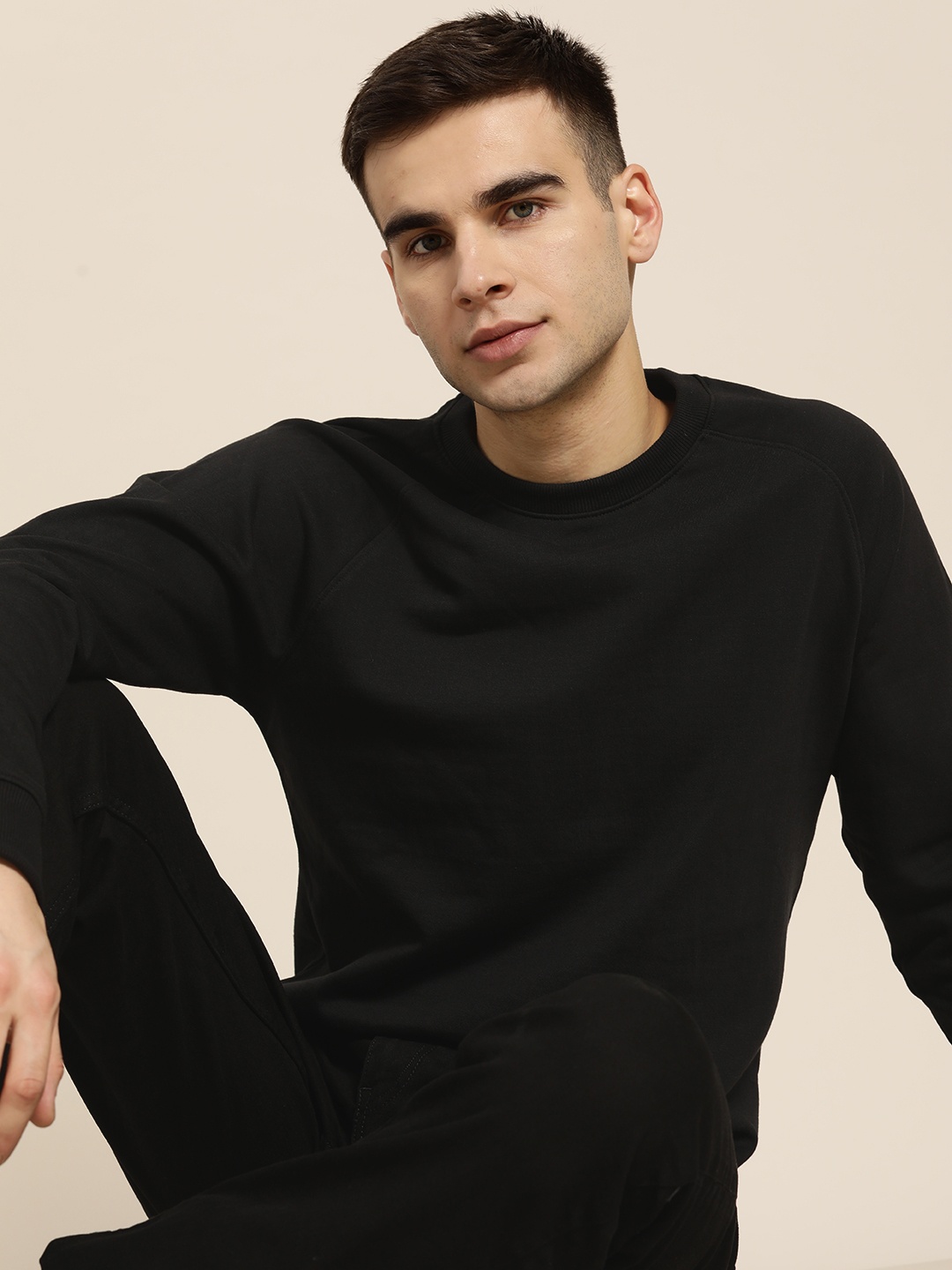 

ether Men Black Solid Sweatshirt
