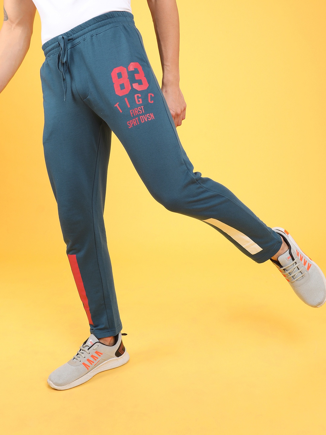 

The Indian Garage Co Men Teal-Blue & White Printed Slim-Fit Track Pants