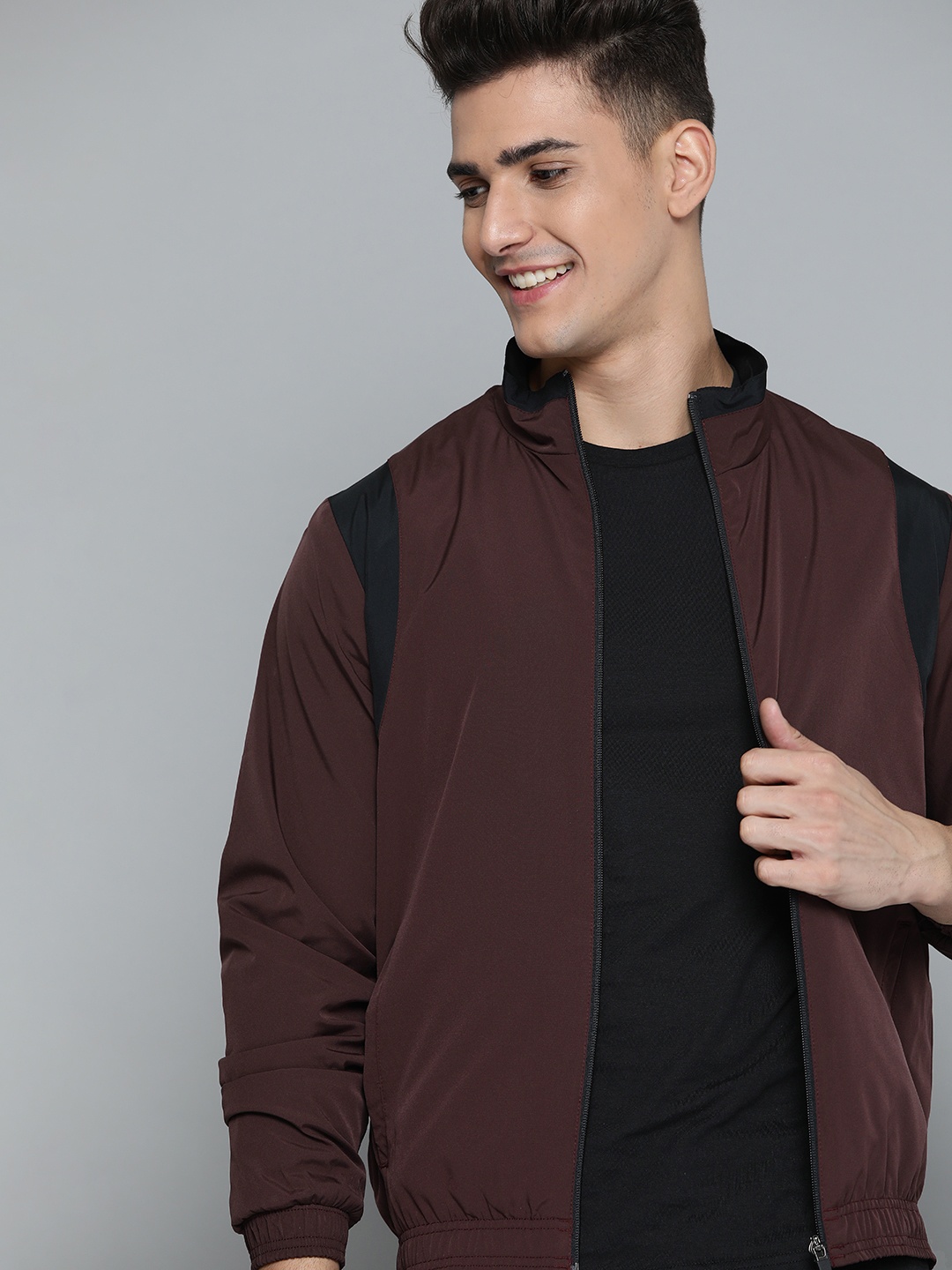 

Mast & Harbour Men Maroon & Black Solid Sporty Jacket