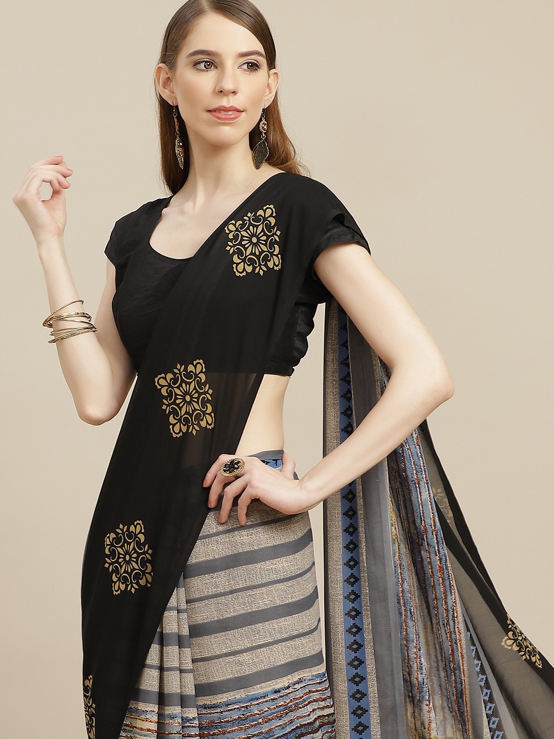 

Anouk Grey & Black Striped Pure Georgette Saree